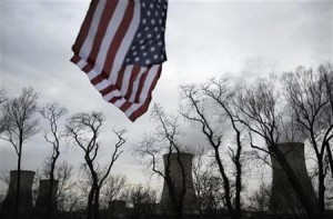 U.S. flag flies near cooling towers of Three Mile Island nuclear power plant, where U.S. suffered its most serious nuclear accident, in Middletown, Pennsylvania